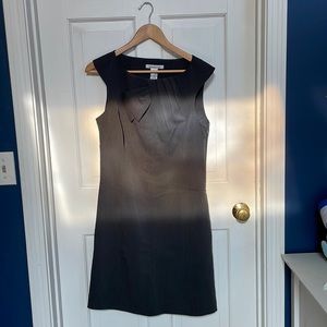 Charcoal grey sleeveless dress.